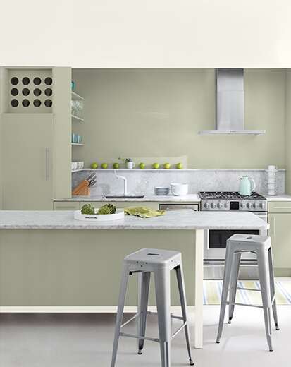 barstools at a central counter in a kitchen